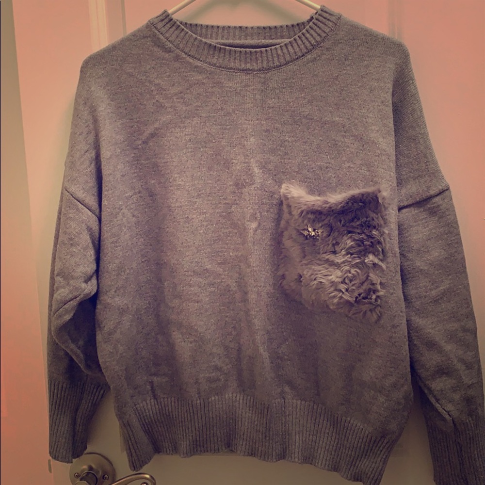 Sweater with fur pocket